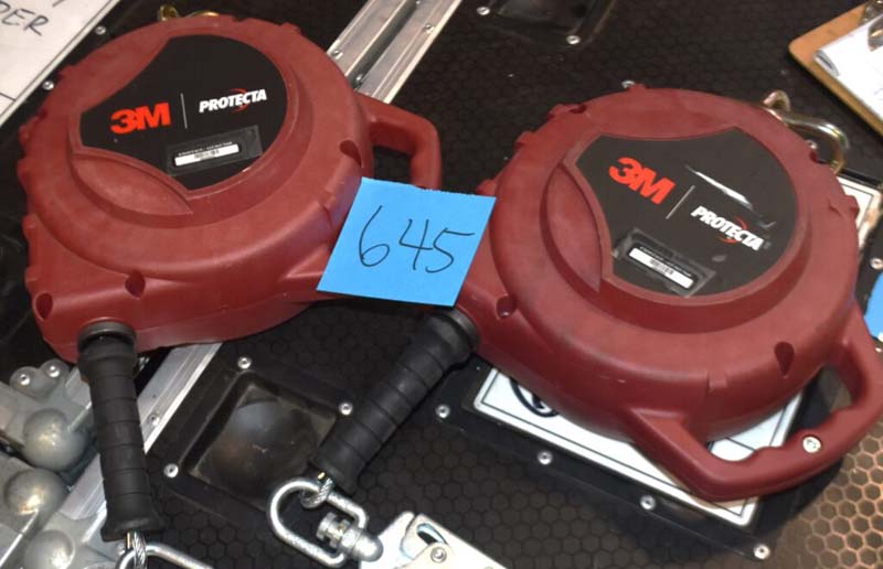 Two red 3M Protecta retractable lifelines with black handles and metal hooks labeled "645".