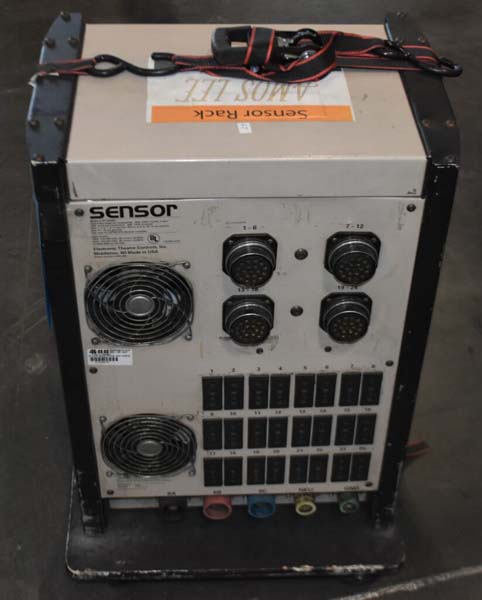 Rectangular electronic device labeled "Sensor Rack" with connectors, fans, and switches.