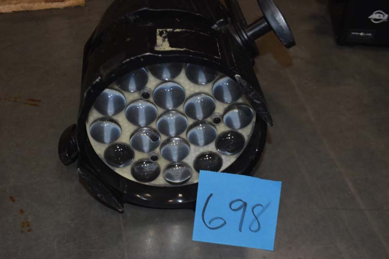 Black cylindrical object with circular compartments labeled "698".