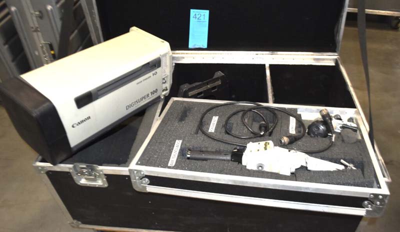 Canon DIGISUPER 100 camera lens and accessories in an open equipment case.