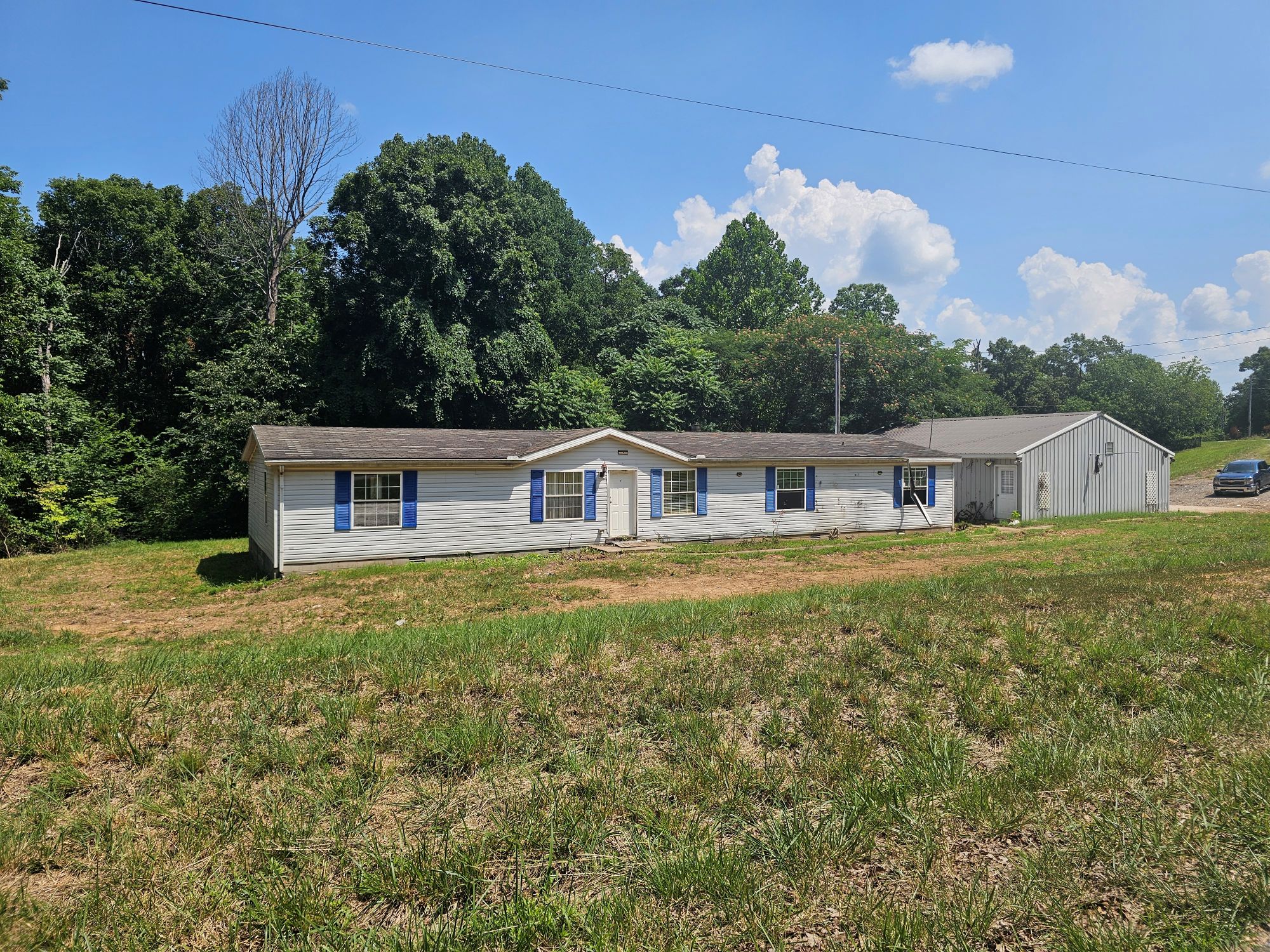 Featured image for “COURT AUCTION FOR THE WARREN ESTATE 1.59 ACRE LOT / 3-BAY GARAGE 3 BEDROOM MODULAR HOME IN NEED OF REPAIR 3472 SMITH PLACE RD., CLARKSVILLE, TN 37040 SATURDAY JULY 25TH 10:30 AM”